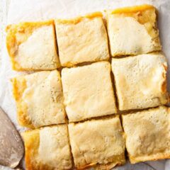 Gooey butter cake recipe, prepared, baked, and cut into squares.