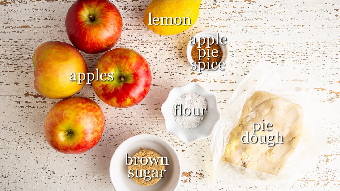 Ingredients for making an apple galette, with text labels.