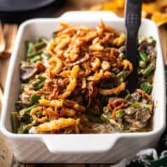 Homemade green bean casserole recipe, baked in a casserole dish and topped with French fried onions.