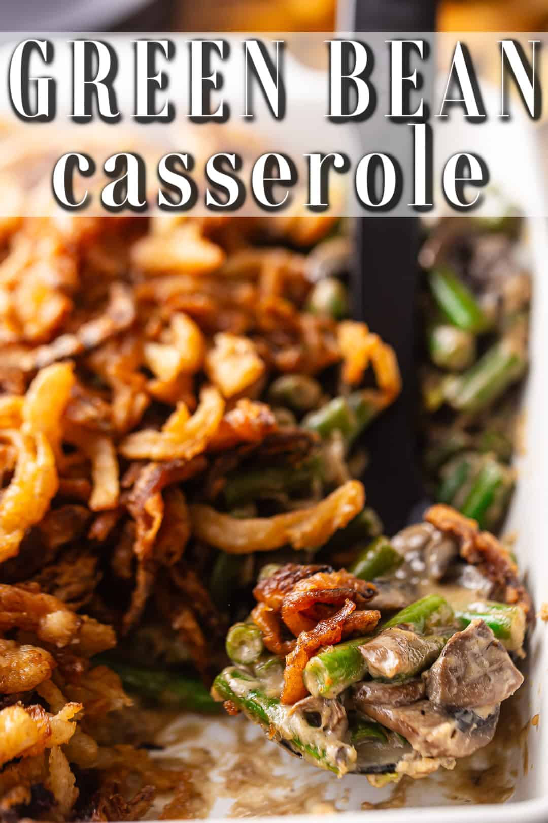 Better than Campbell's green bean casserole, made and served in a white ceramic baking dish.
