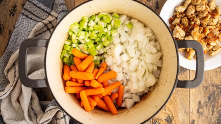 Sauteeing mire poix in a large pot.