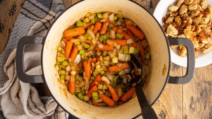 Cooked onions, carrots and celery in a large pot.