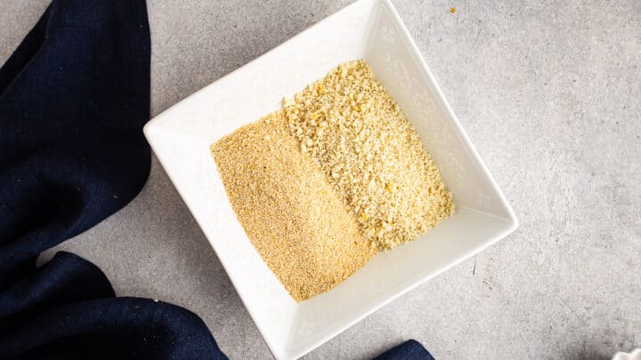 Unseasoned breadcrumbs and panko in a square dish.