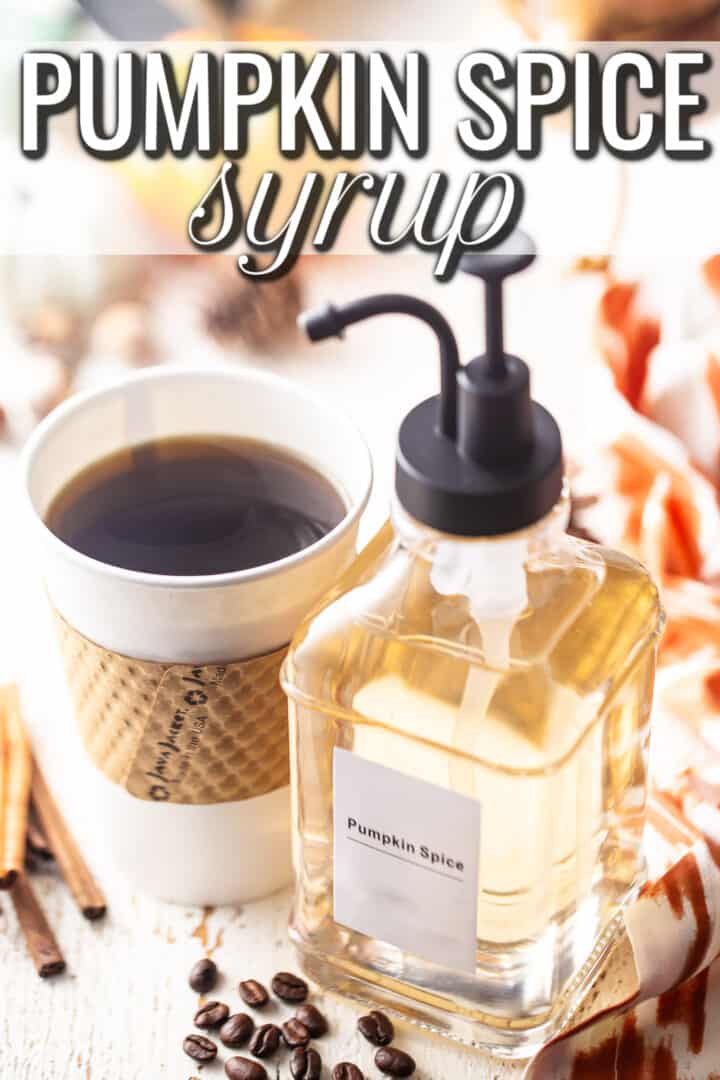 Pumpkin spice syrup recipe made and displayed in a glass bottle with a cup of coffee.