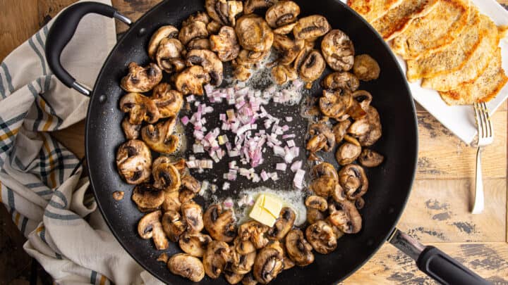 Sauteeing mushrooms and shallot in butter.