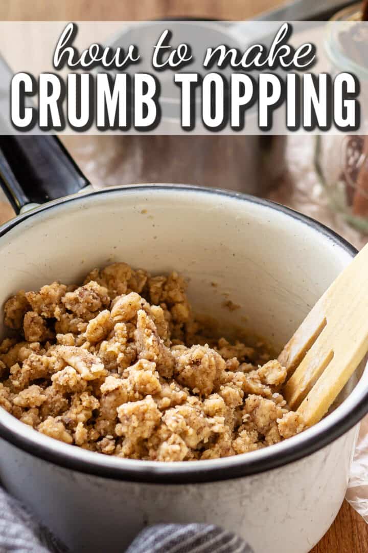 Streusel topping in a pot with a wooden fork.