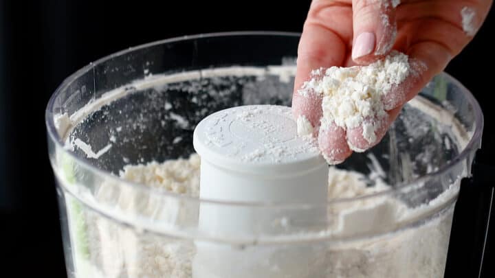 Butter worked into dry ingredients until the mixture resembles coarse meal.