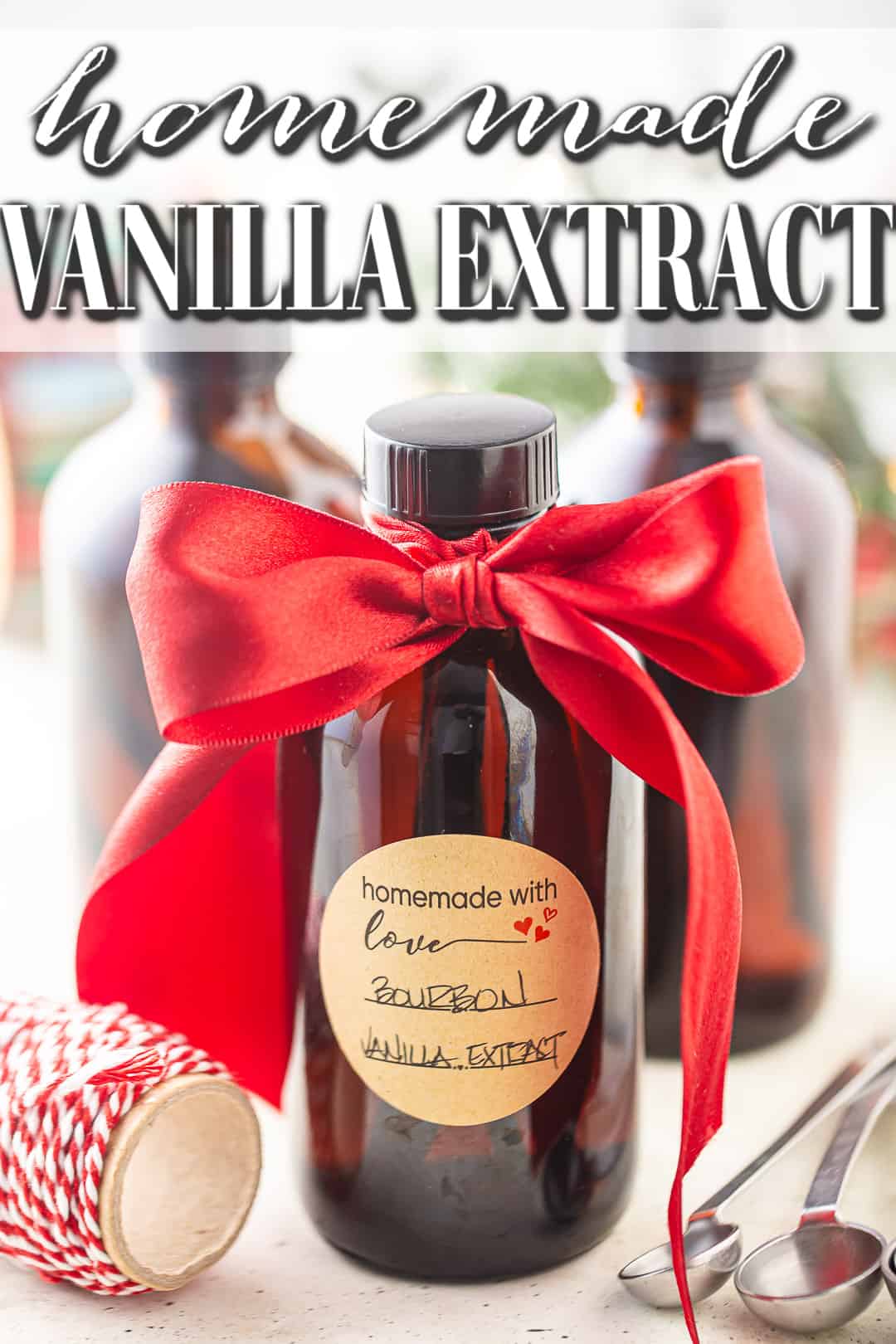 Homemade vanilla extract with sticker label and a red bow.