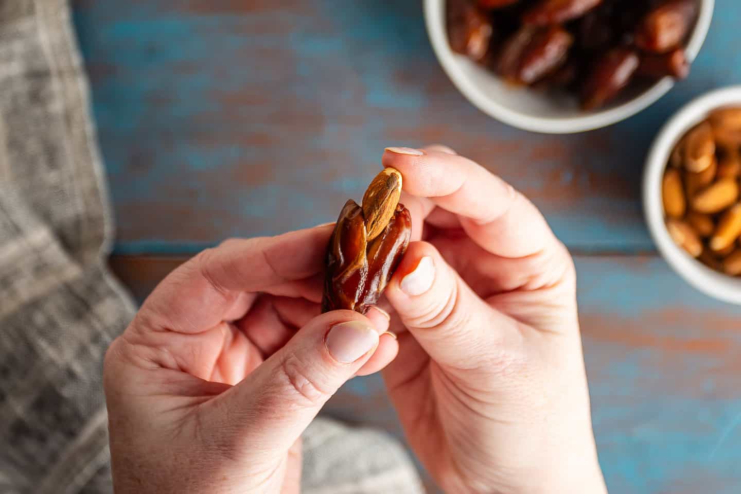 Stuffing a date with a whole almond.