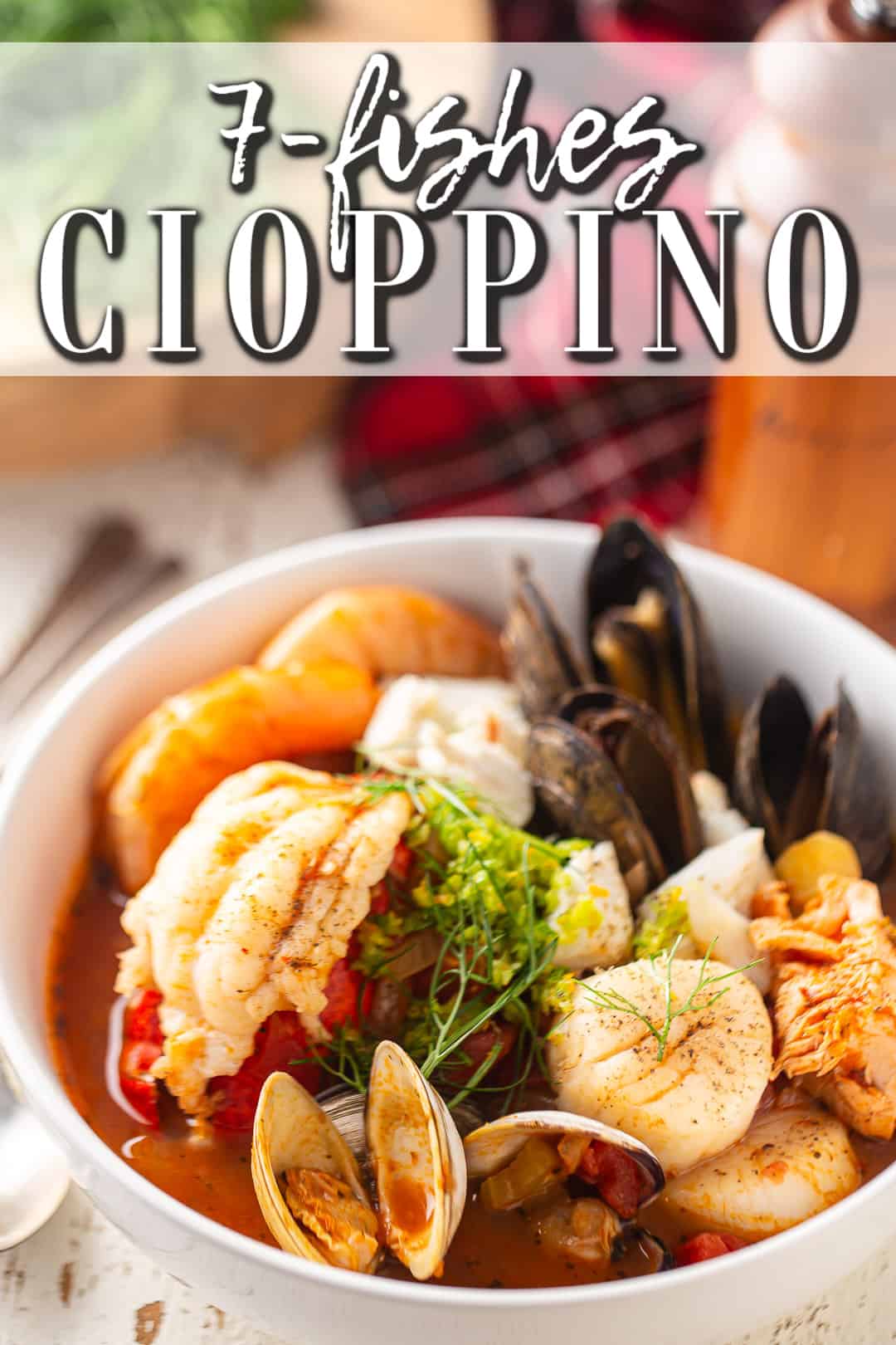 Cioppino recipe, prepared and served in a white bowl with a red plaid napkin.