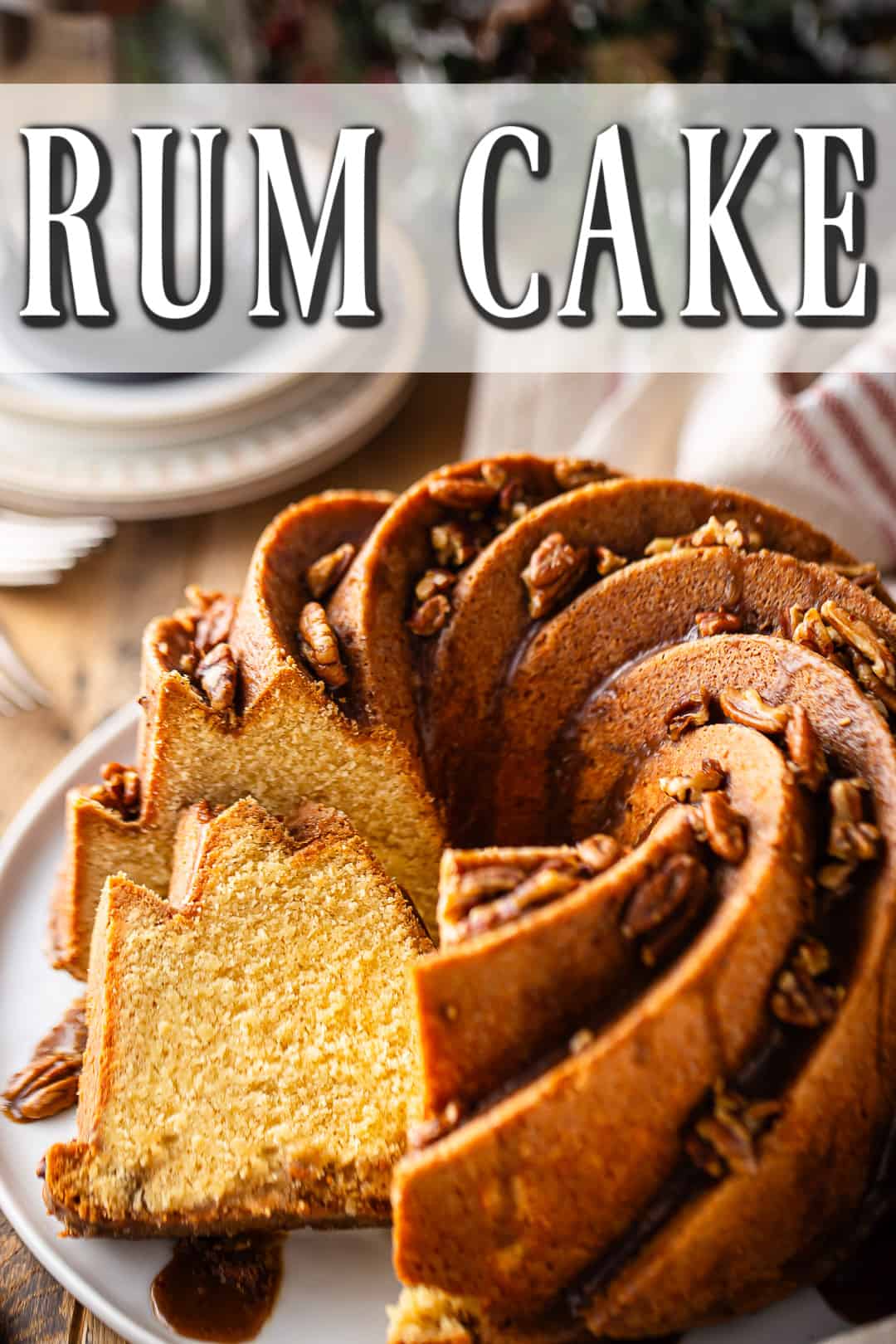 Rum cake recipe, baked in a spiral bundt pan and drizzled with buttery rum pecan glaze.