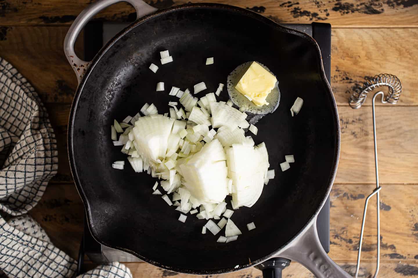 Sauteeing chopped onion in butter.