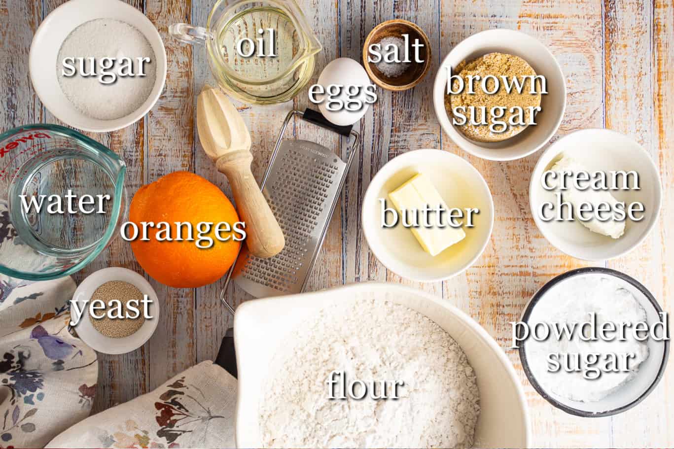 Ingredients for making orange rolls, with text labels.