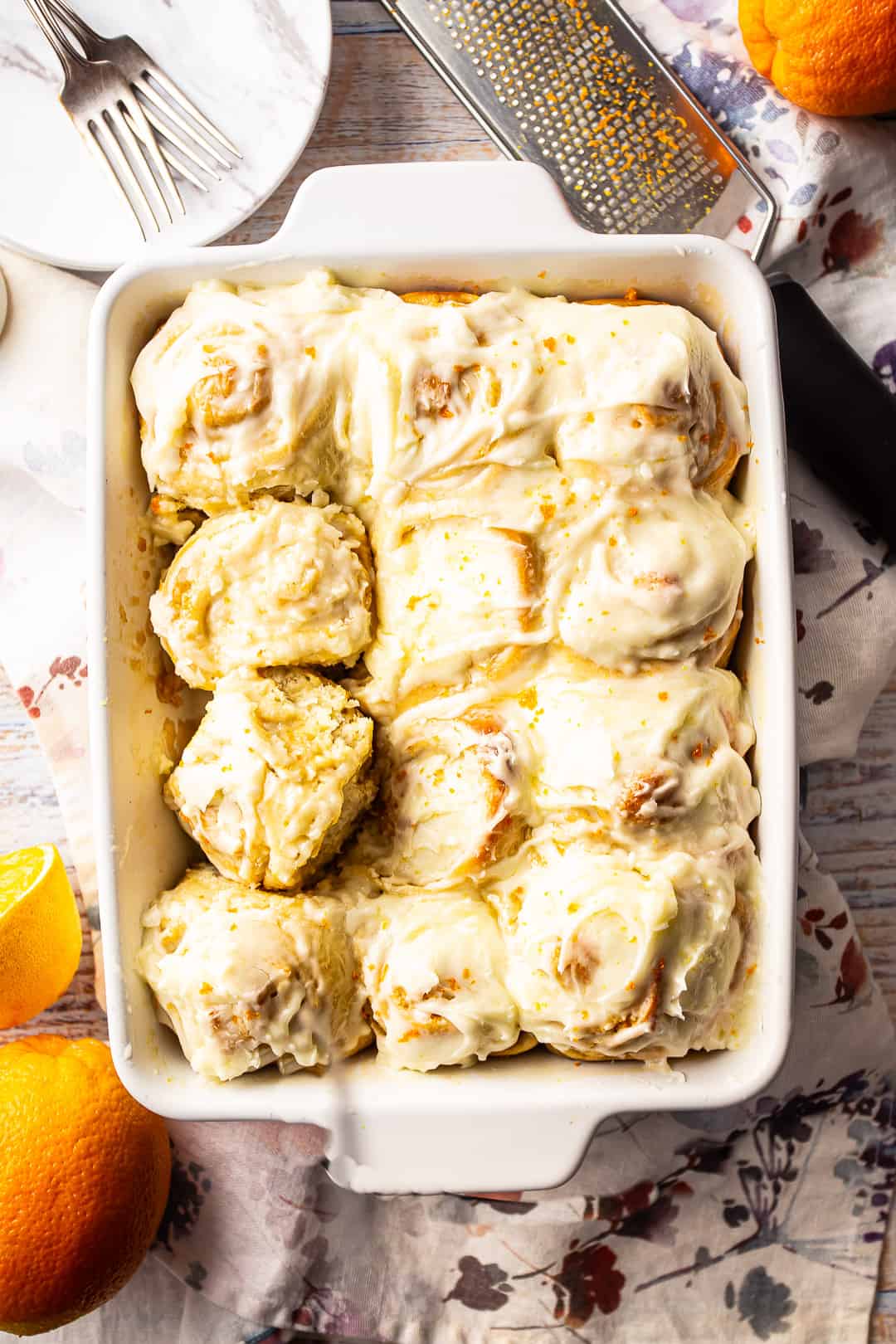 Orange roll recipe, baked in a rectangular dish and slathered with cream cheese icing.
