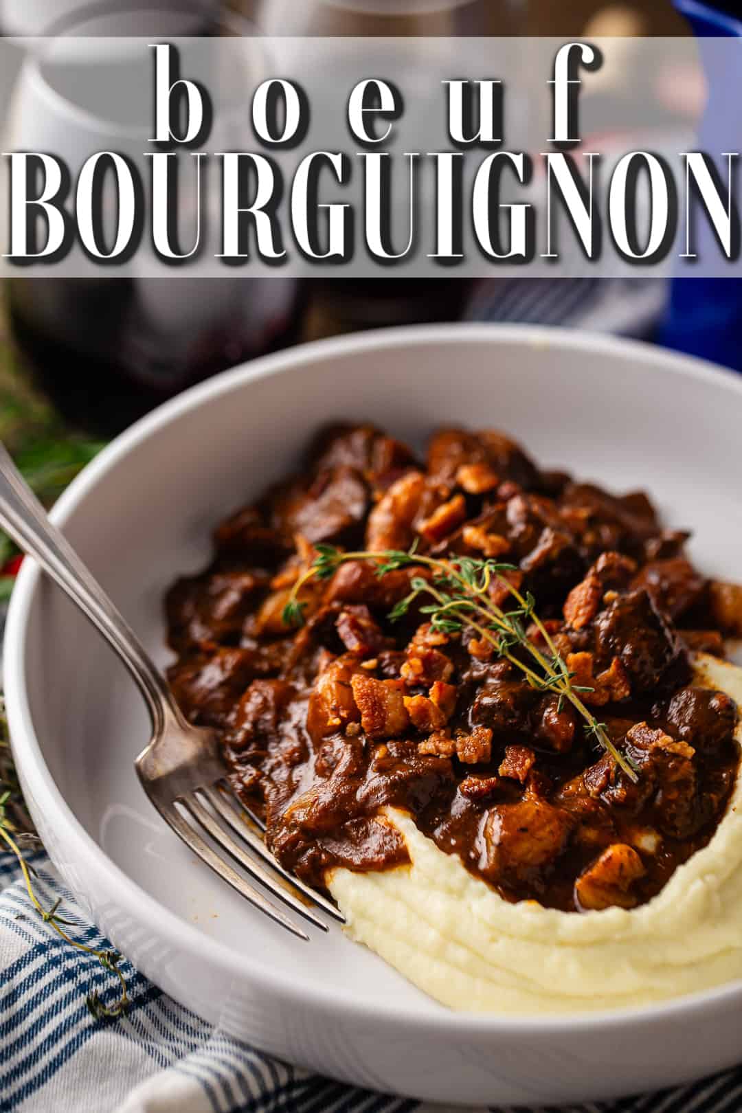 Authentic boeuf bourguignon, presented in a shallow ceramic bowl with creamy mashed potatoes.