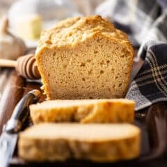 Beer bread recipe, baked and presented on a wooden tray.