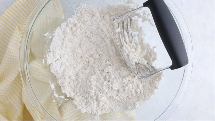 Butter cut into dry ingredients, to create a mixture like coarse crumbs.