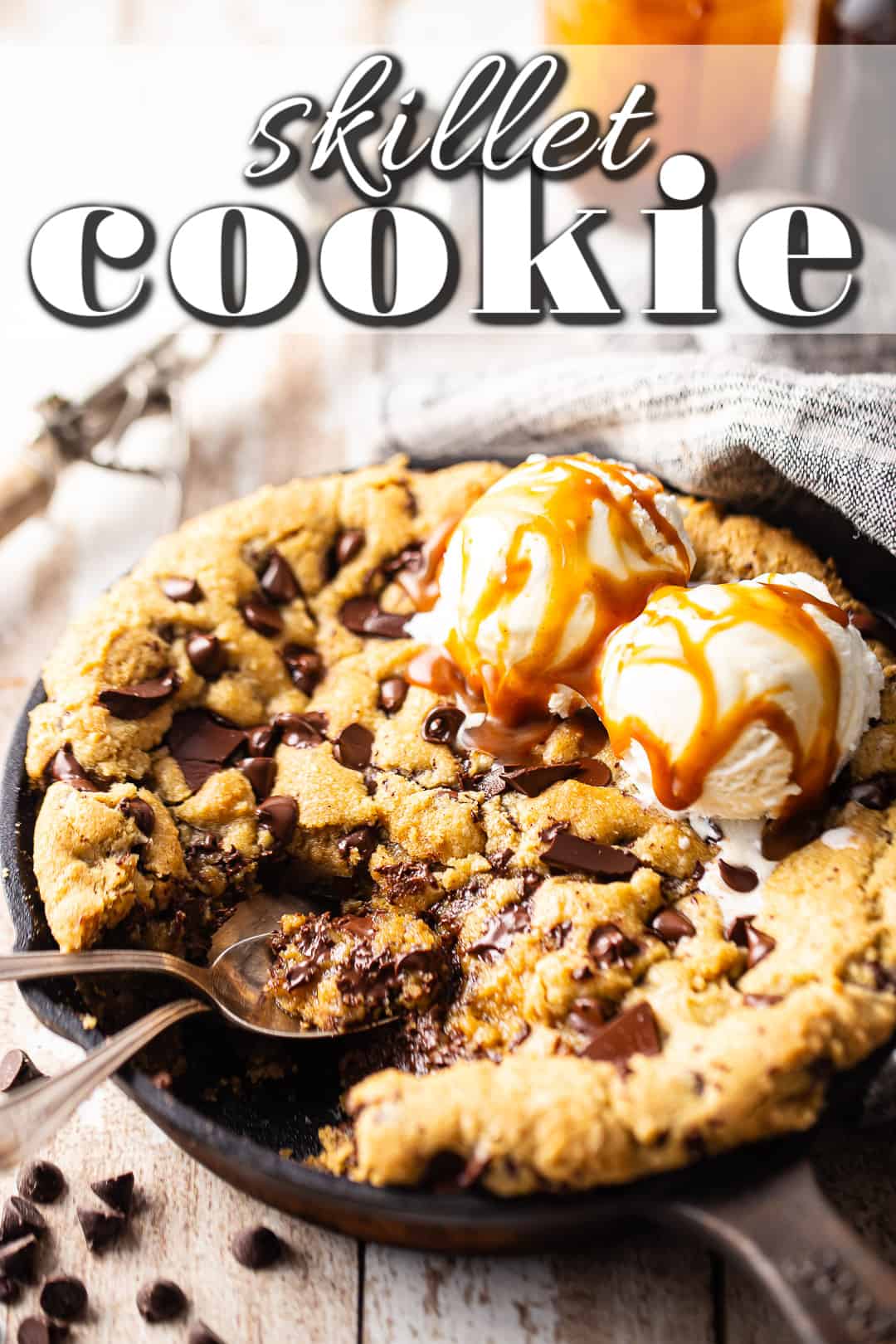 Skillet cookie recipe, baked and topped with ice cream and caramel sauce.
