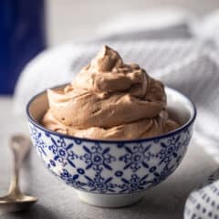 Chocolate whipped cream piled into a blue and white bowl.