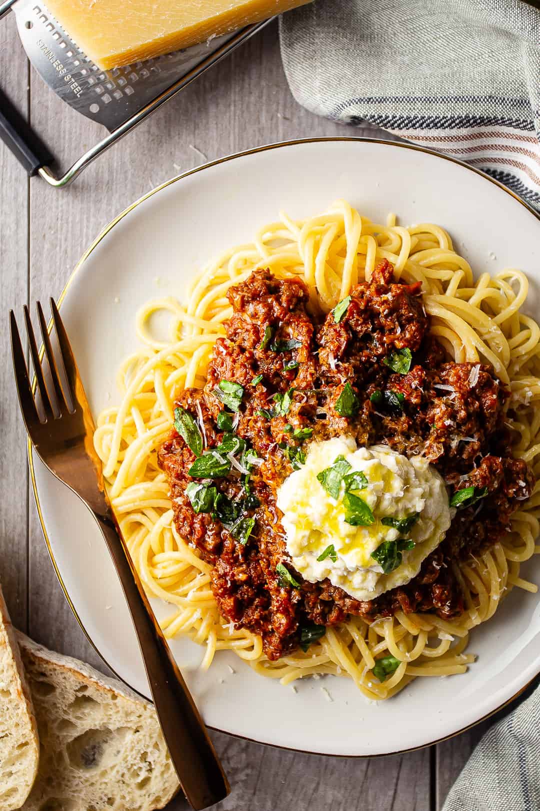 Bolognese sauce served over pasta with olive oil and parmesan.