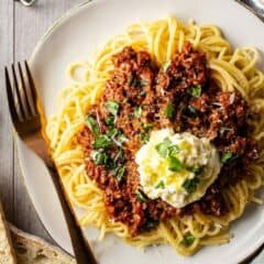 Bolognese sauce served over pasta with olive oil and parmesan.
