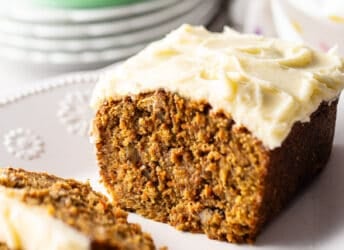 Carrot cake loaf with a thick blanket of cream cheese frosting.