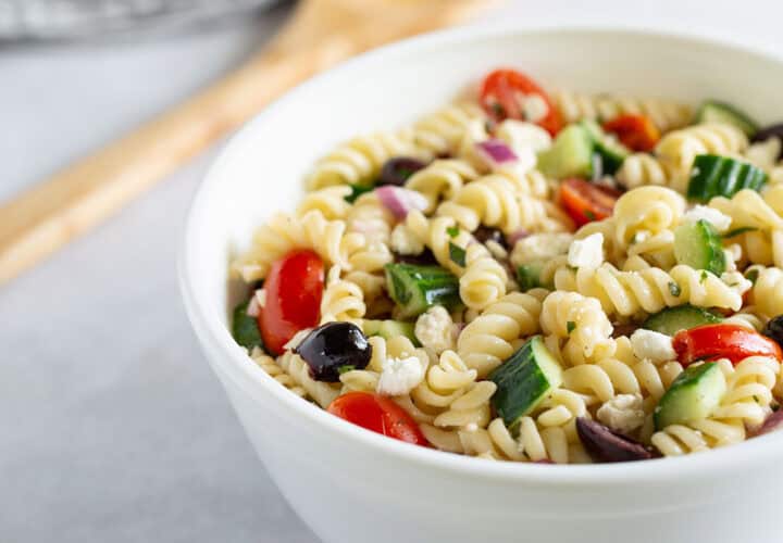 Close up of Greek pasta salad in a bowl.