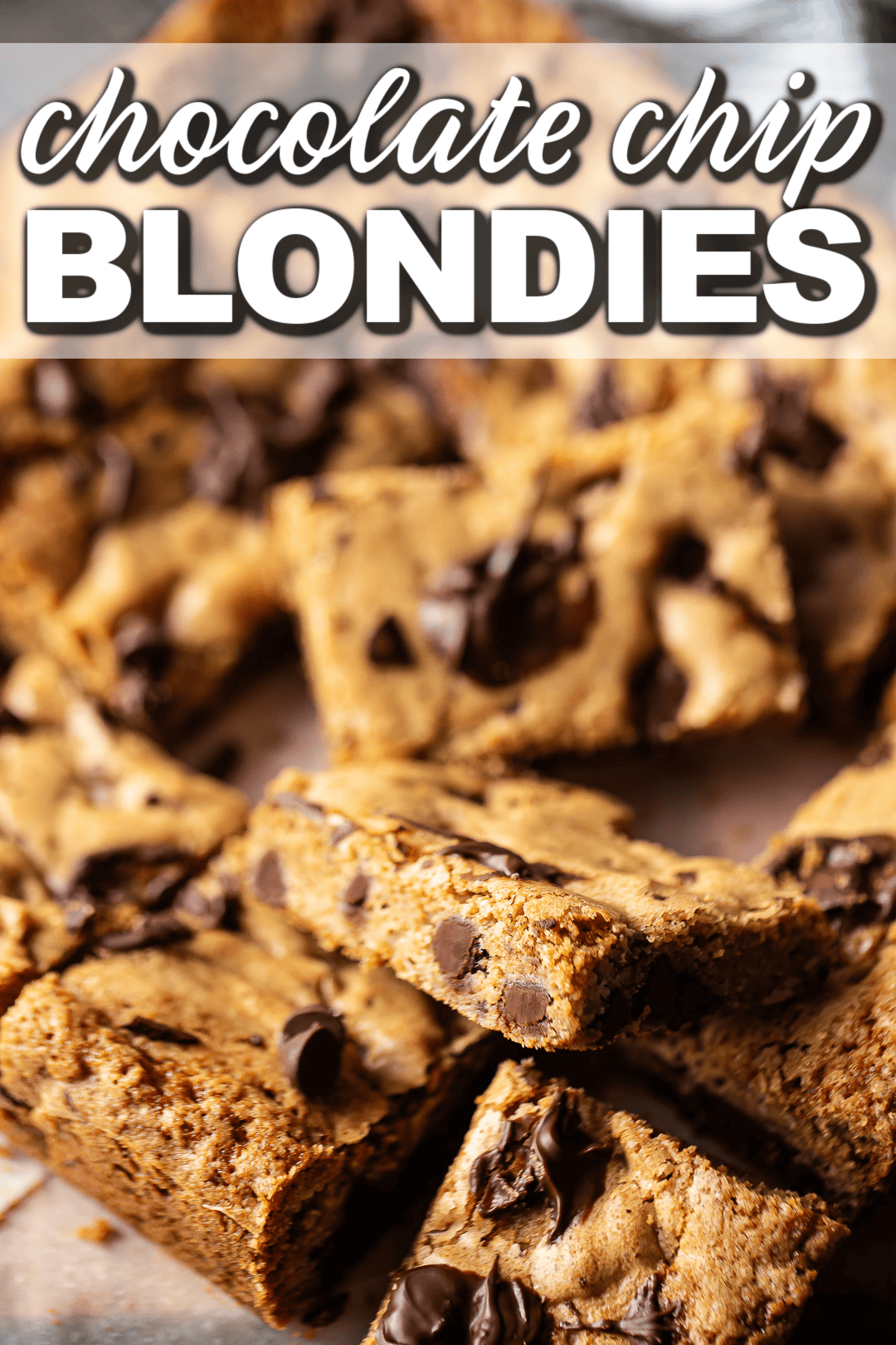 Blondie chocolate chip shown from the side to showcase the moist, chewy texture.