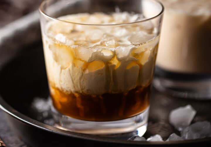 White Russian cocktail in a low ball glass with crushed ice.