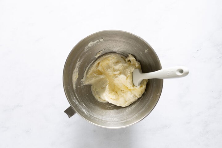 Butter and sugar whipped together in a stand mixer bowl