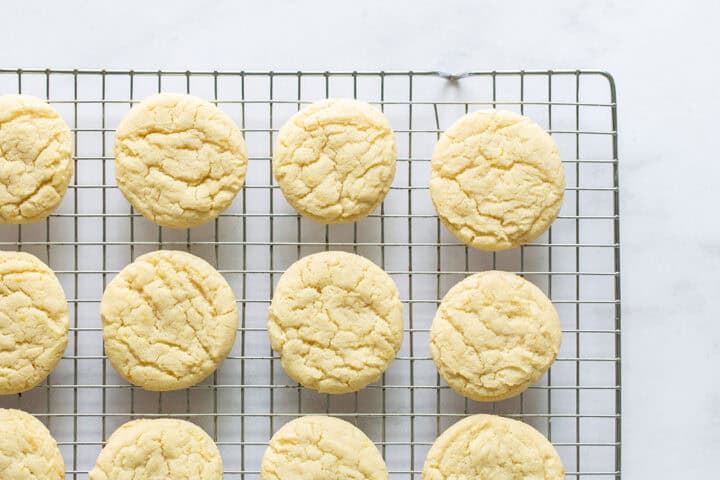 Unfrosted lemon cookies on a wire cooling rack