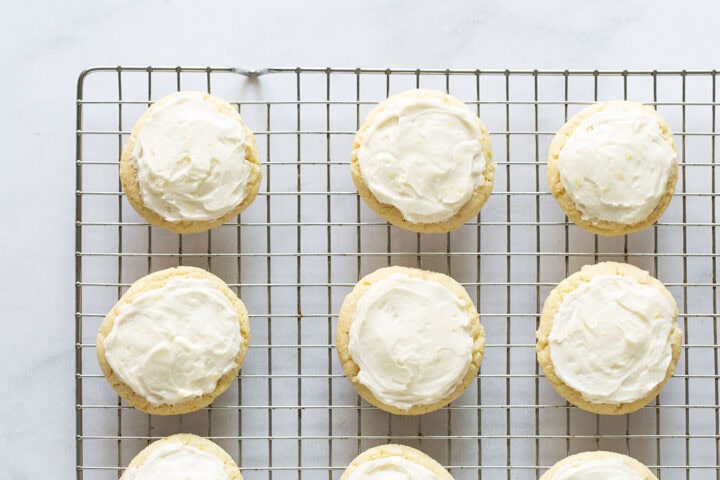Lemon cookies on a wire cooling rack.
