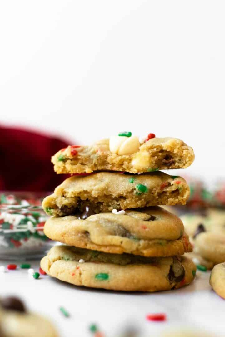 stacked cake batter chocolate chip cookies with sprinkles.