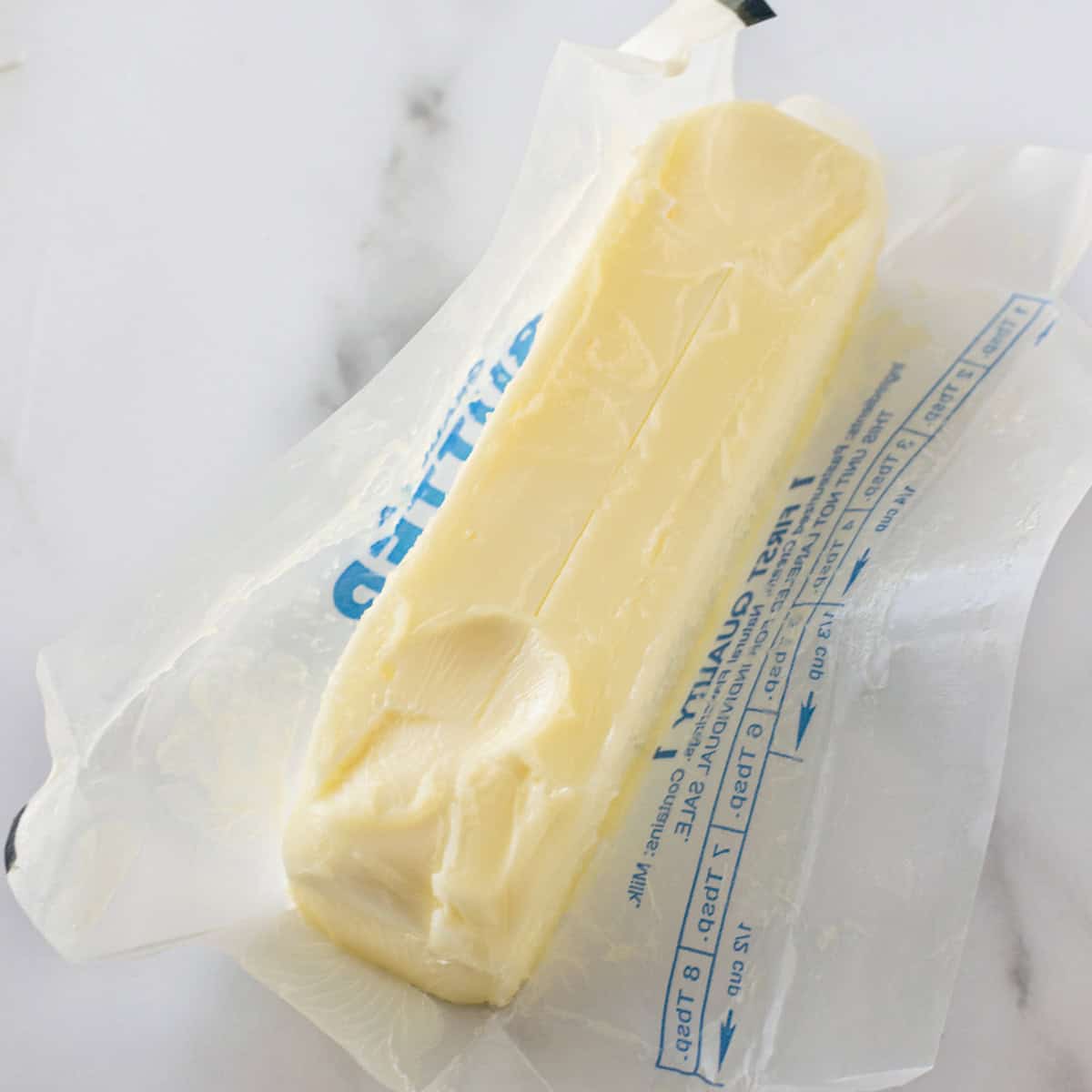 softened butter sitting in butter wrapper.