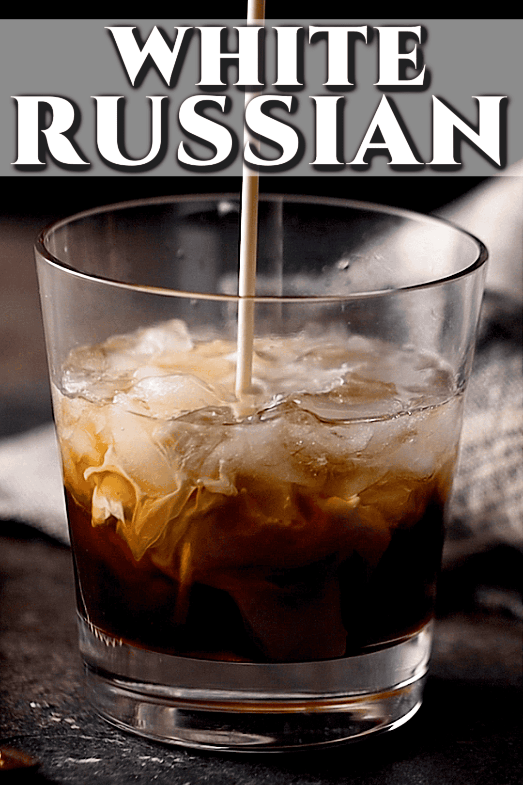 Pouring cream into a white Russian recipe.