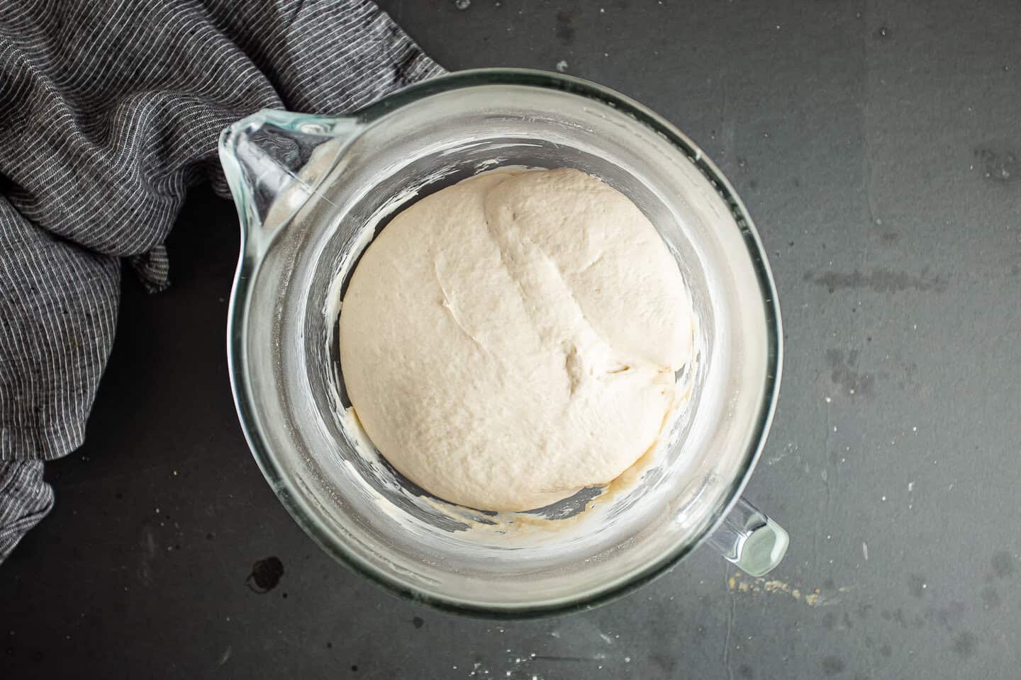 Pita bread dough risen to twice its original volume.