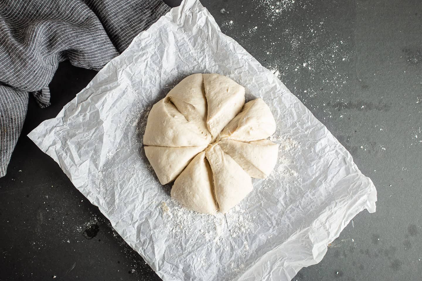 Dividing pita bread dough into 8 equal portions.