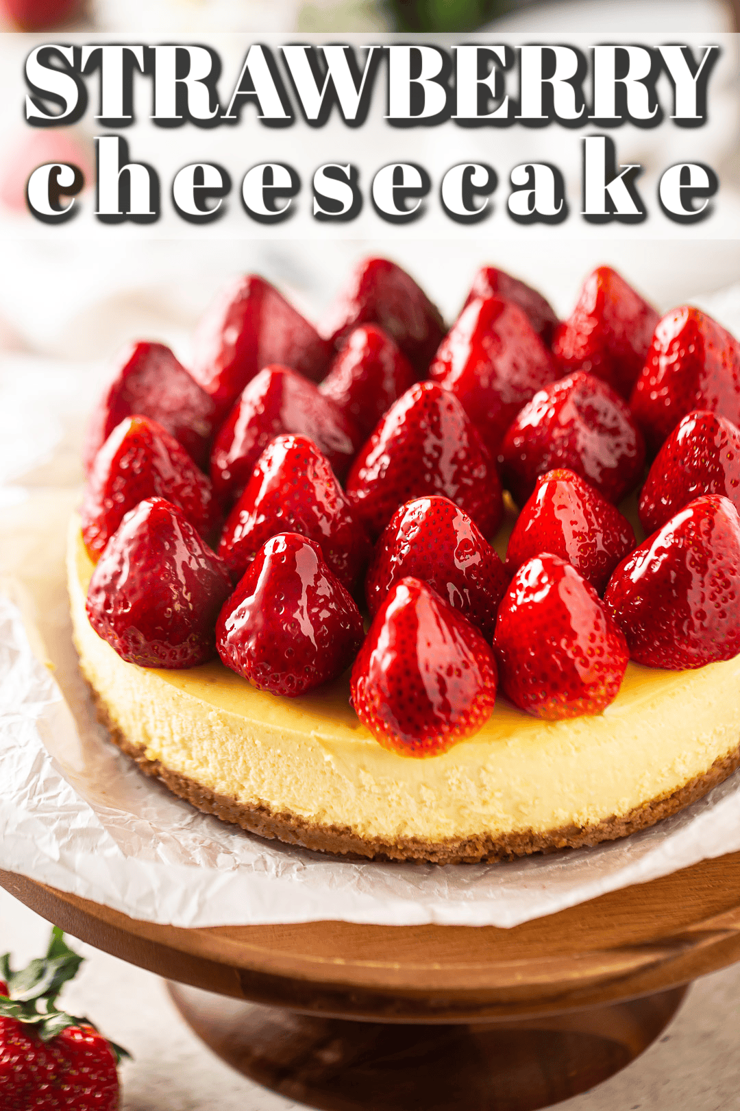 Strawberry cheesecake recipe baked, topped and presented on a light background.