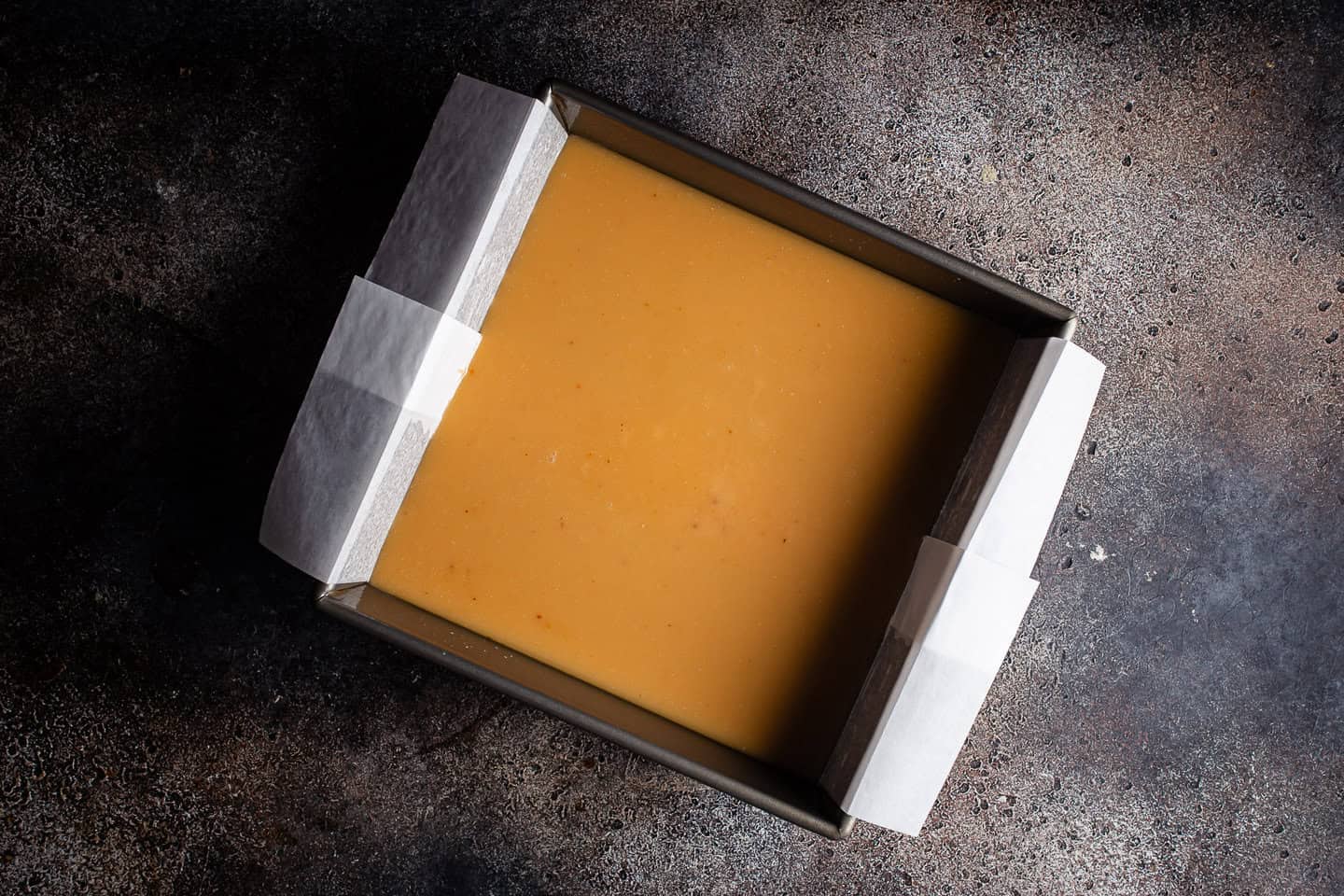 Salted caramel in a square baking pan.