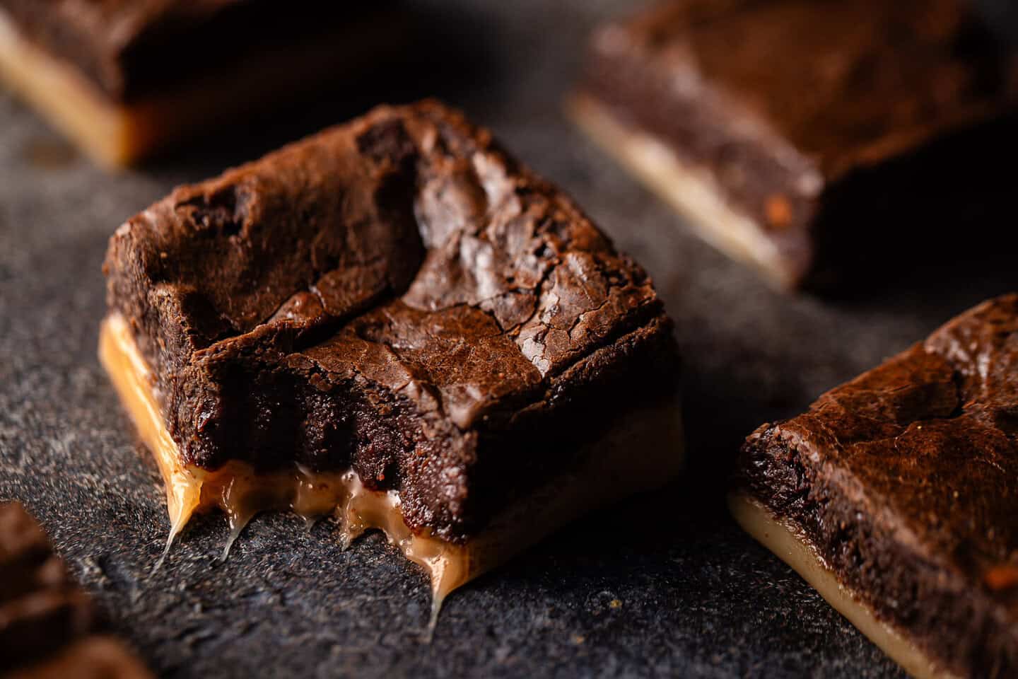 Salted caramel brownie recipe baked and cut into squares.