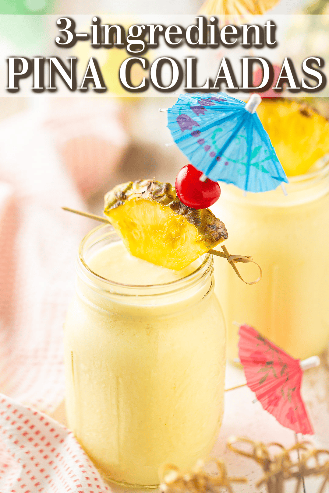 Pina colada recipe blended and garnished with fresh pineapple and maraschino cherries.