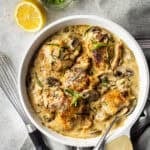 Overhead image of chicken Dijon in a white ceramic skillet