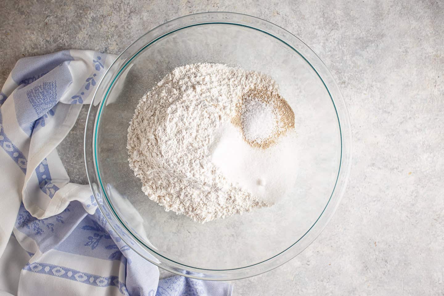 Flour, sugar, yeast, and salt in a large bowl.
