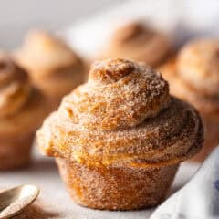 A cruffin pastry with cinnamon sugar coating.