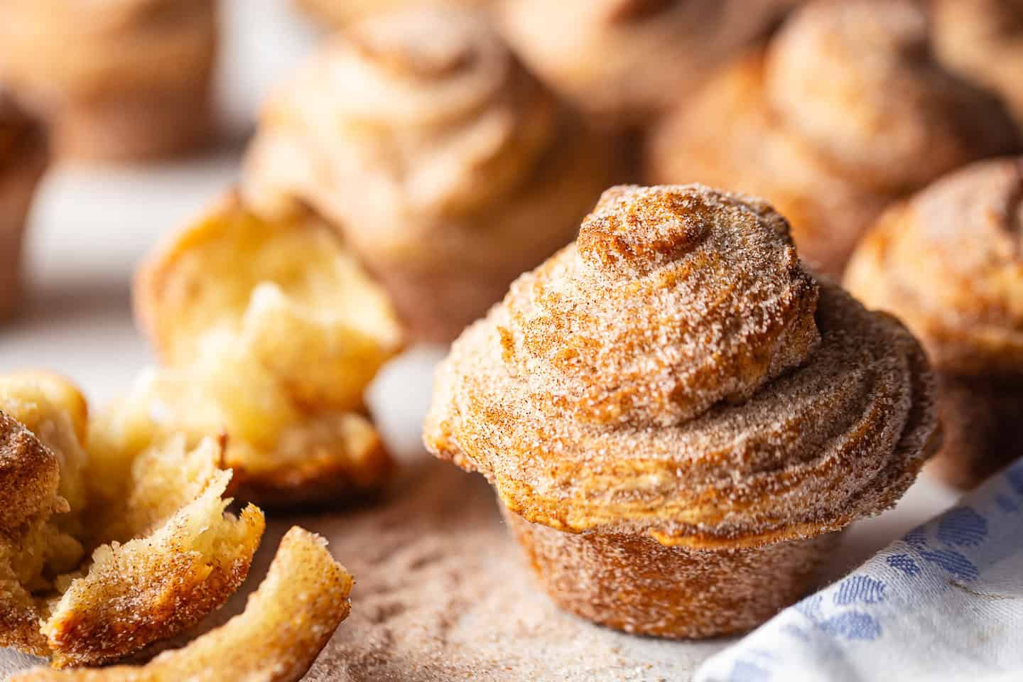 Recipe for cruffins, prepared and displayed on a white background with a periwinkle blue cloth.