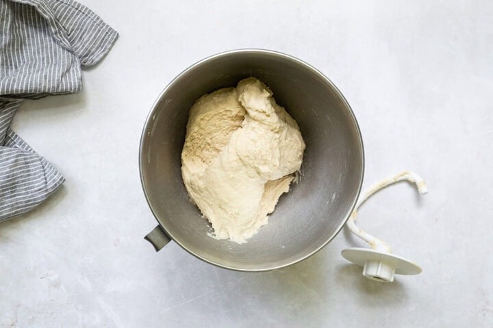 English muffin dough in a stand mixer bowl