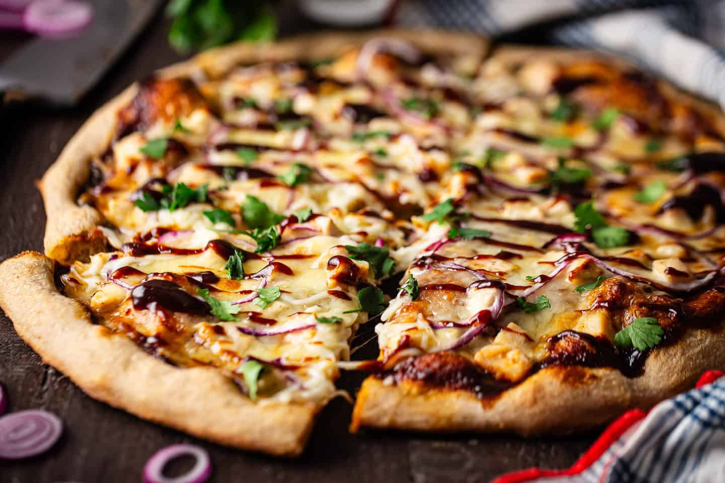 Chicken barbecue pizza recipe fresh from the oven with extra barbecue sauce drizzled on top.