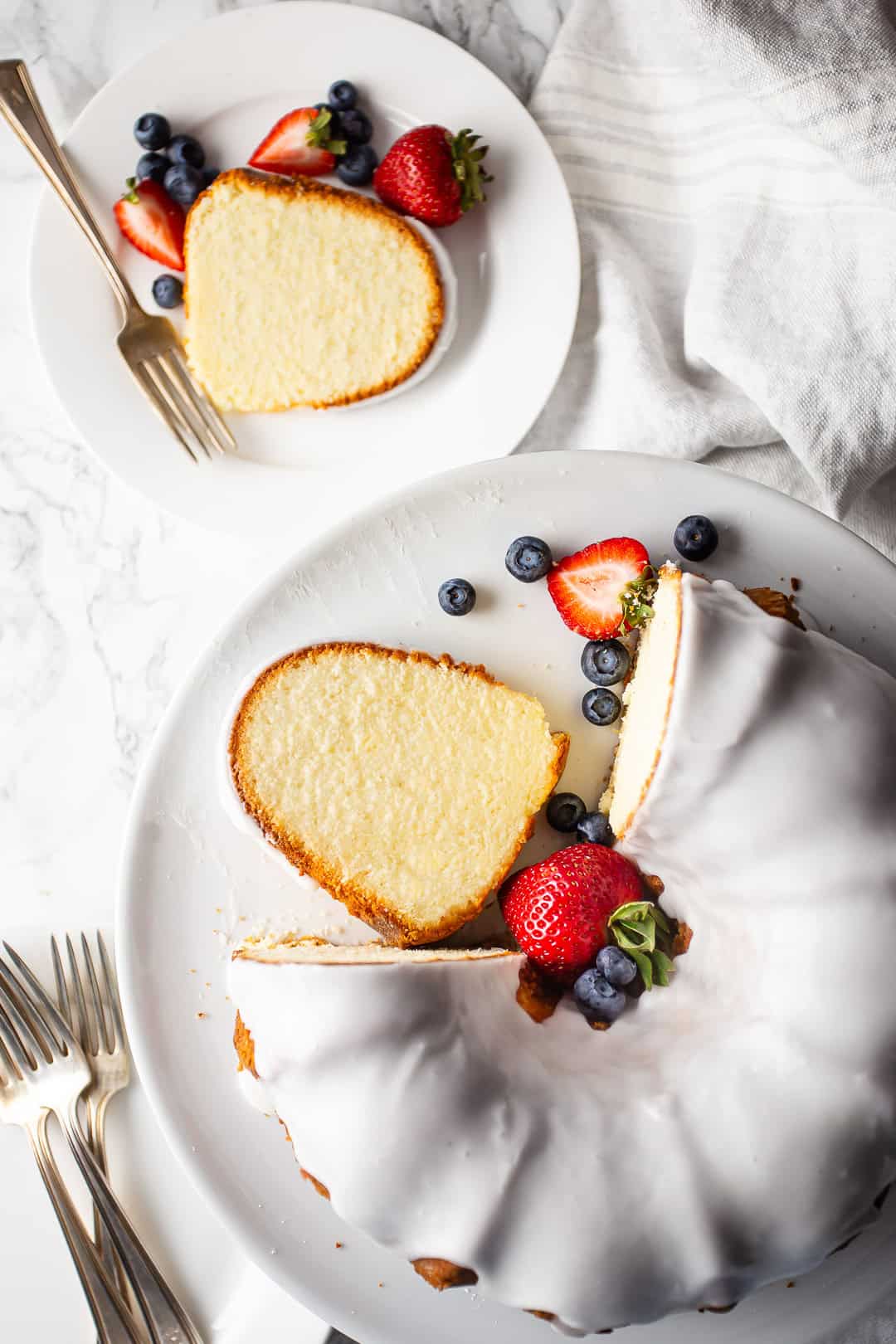 Overhead image of a pound cake recipe with cream cheese, prepared, baked, and sliced.