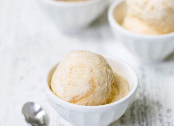 Peach ice cream in three bowls