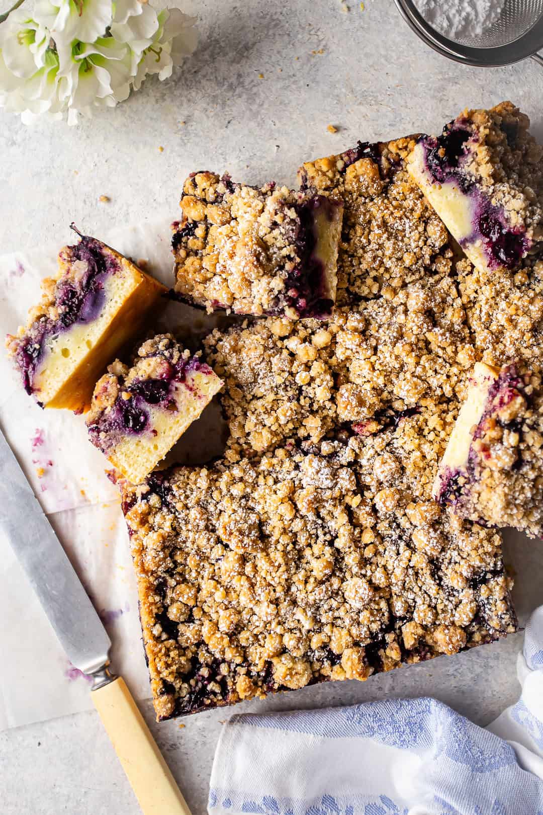 Overhead image of blueberry buckle cut into squares.